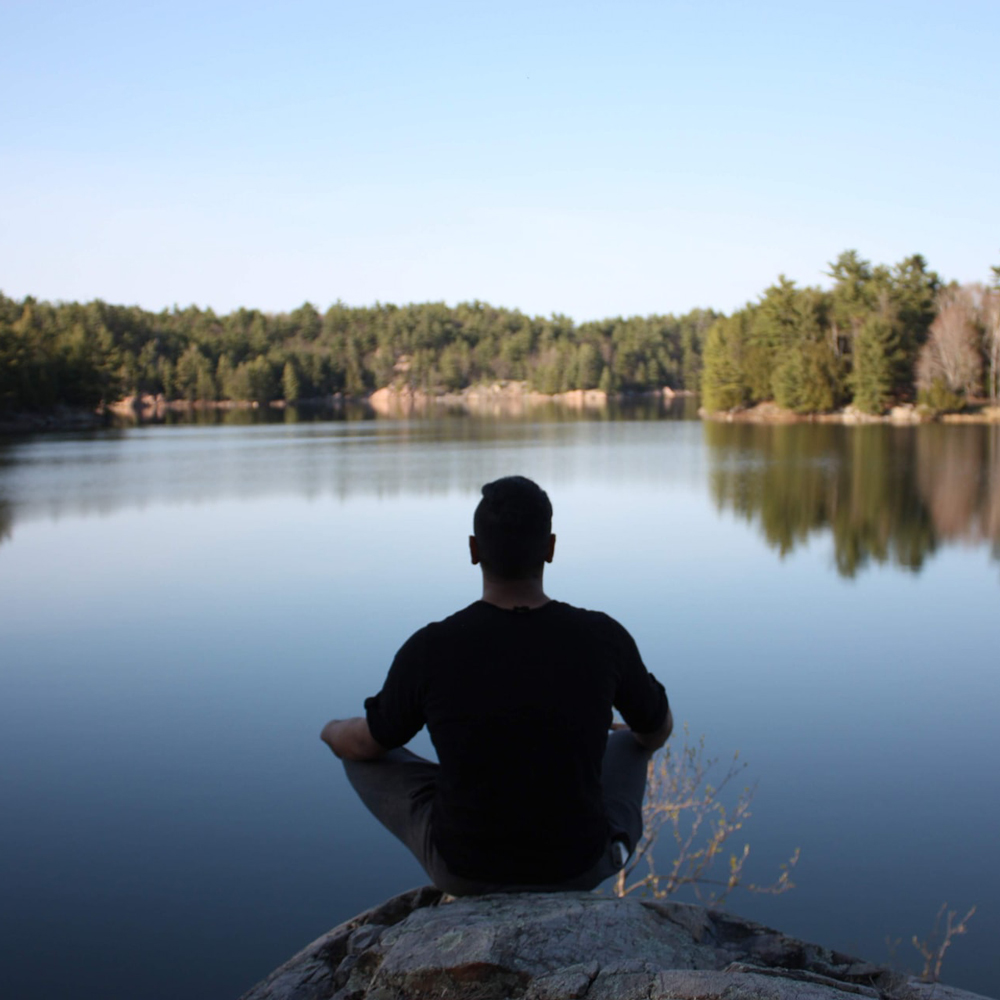 Woman thinking looking out to a lake