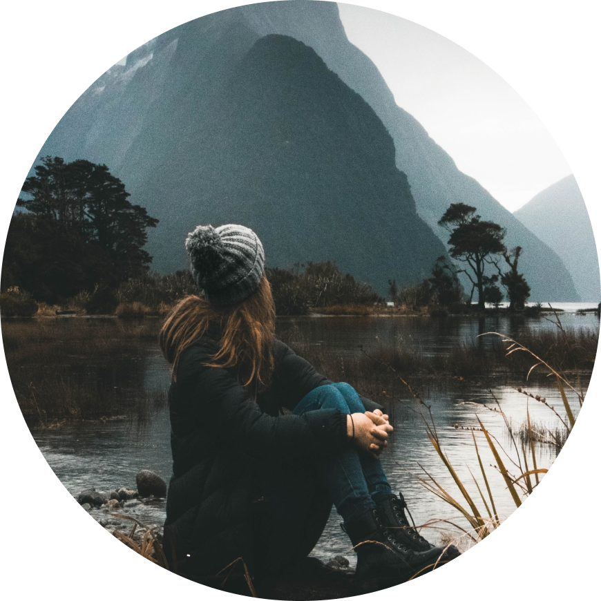 Woman thinking looking out to a lake